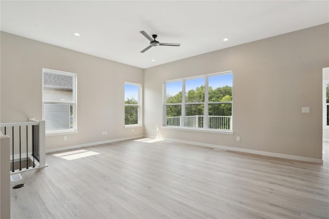 unfurnished living room with light hardwood / wood-style flooring and ceiling fan