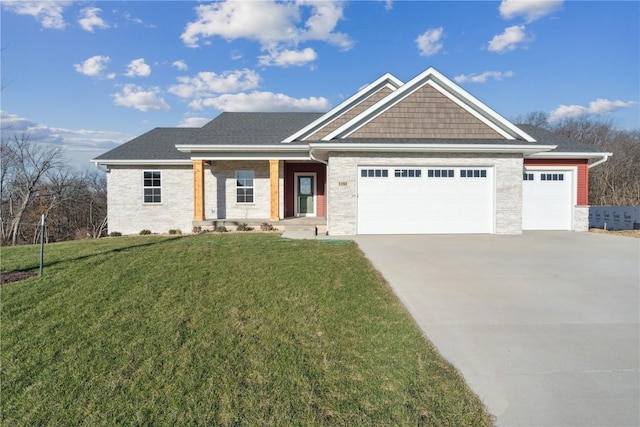 view of front of home featuring a garage and a front lawn