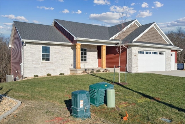 view of front facade with central AC unit, a garage, and a front lawn