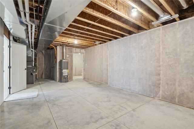 basement featuring gas water heater and heating unit