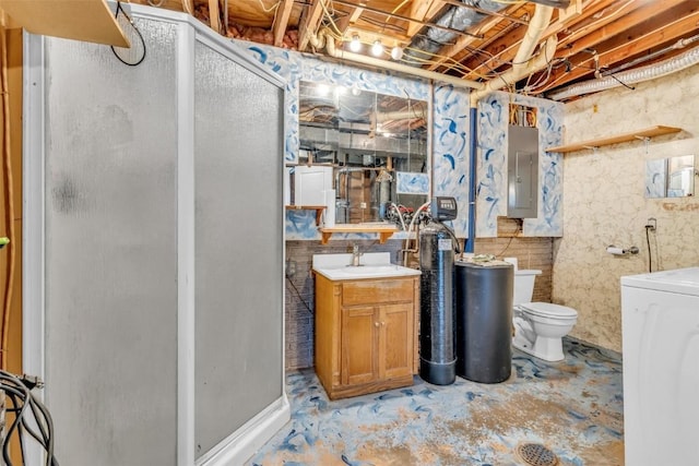 bathroom with toilet, a stall shower, unfinished concrete floors, washer / dryer, and electric panel