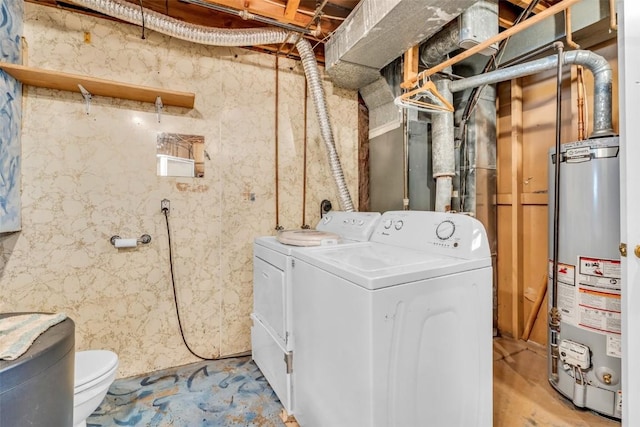 laundry area with washer and dryer, laundry area, and water heater