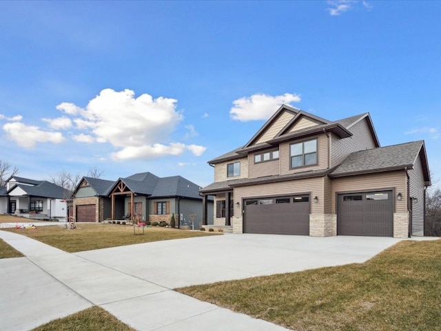 craftsman-style home featuring a garage and a front lawn