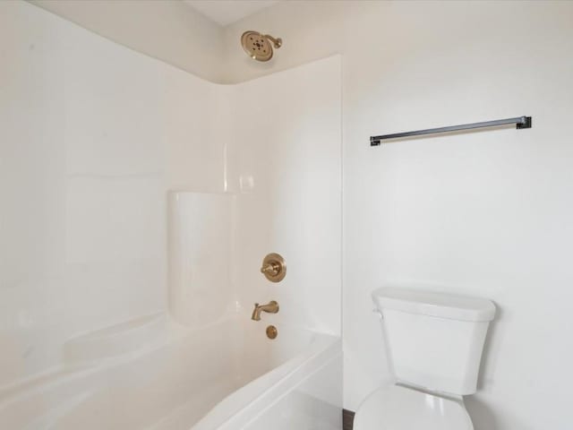 bathroom with shower / tub combination and toilet