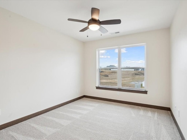 unfurnished room with light carpet and ceiling fan