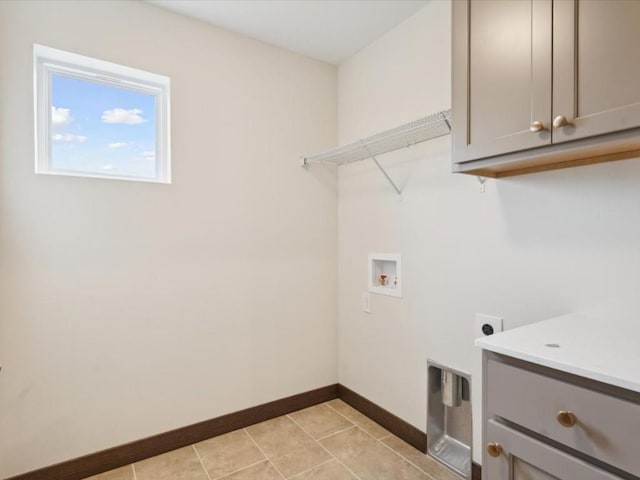 laundry room featuring cabinets, washer hookup, electric dryer hookup, and light tile patterned flooring