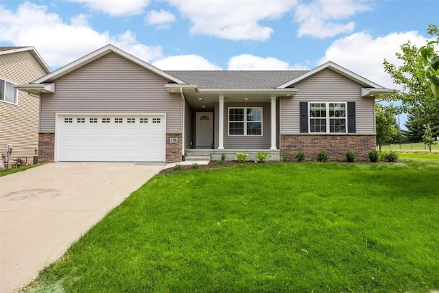 view of front of home featuring a front lawn and a garage