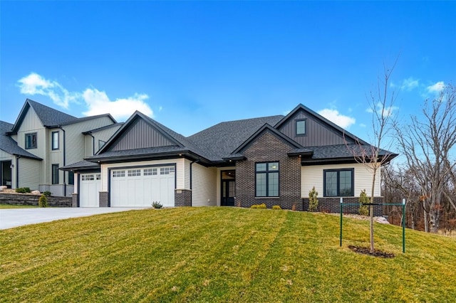 view of front of property with a garage and a front lawn