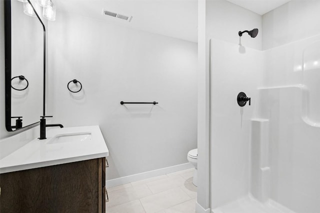 bathroom with tile patterned flooring, a shower, vanity, and toilet