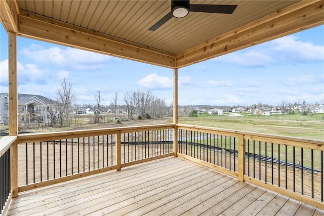 wooden terrace featuring ceiling fan