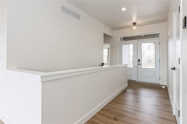 entrance foyer with french doors and wood-type flooring