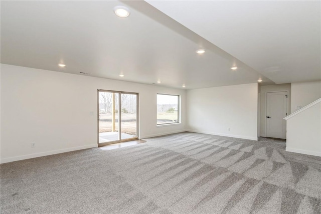 unfurnished living room with light carpet