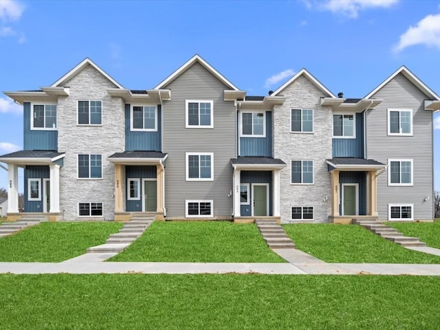 view of property featuring a front yard