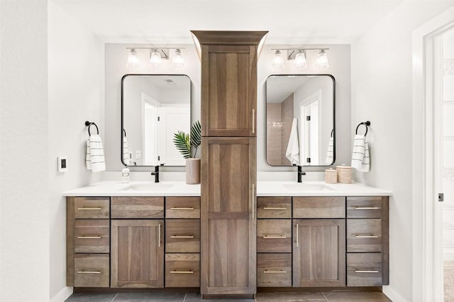 bathroom featuring tile patterned flooring and vanity