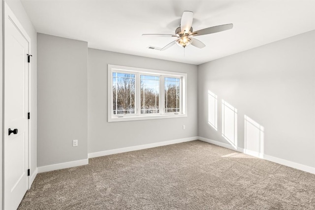 carpeted empty room featuring ceiling fan