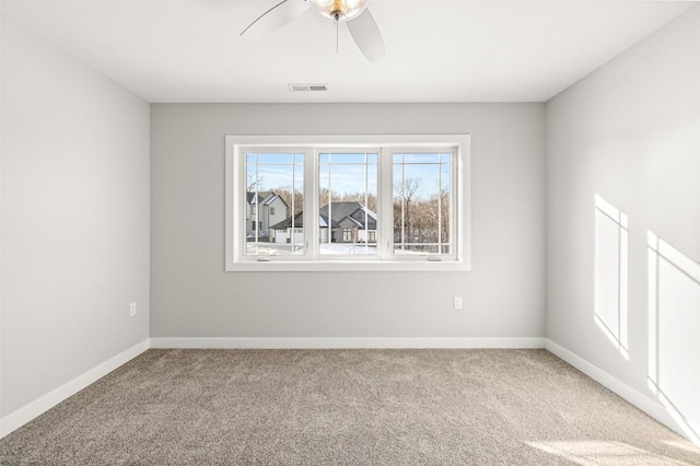 empty room with carpet and ceiling fan