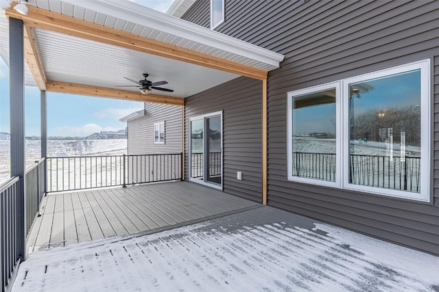 snow covered deck featuring ceiling fan