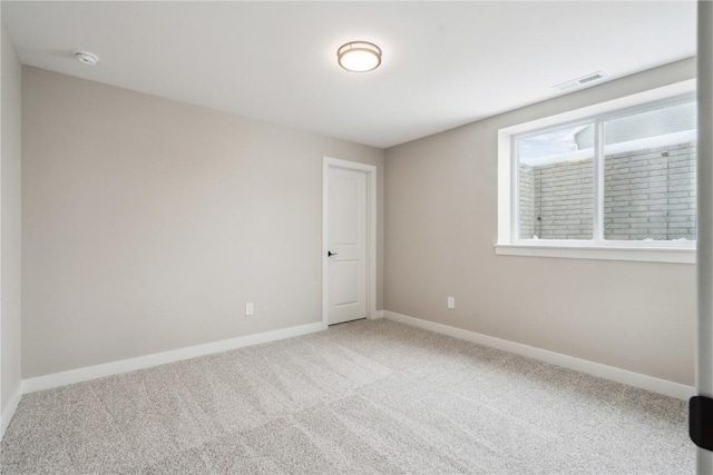 unfurnished room featuring carpet