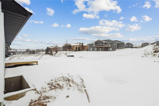 view of yard layered in snow