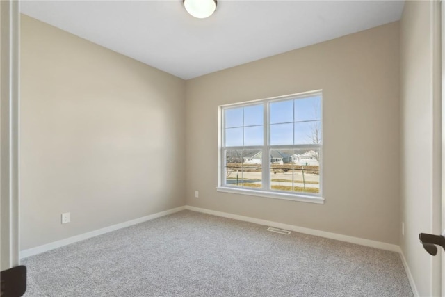 unfurnished room featuring carpet