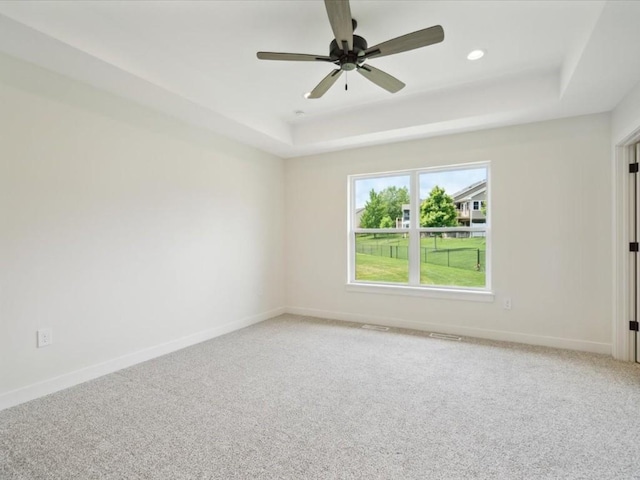 261 Colchester Dr, Iowa City, IA 52245 - empty room featuring a tray ceiling, light carpet, baseboards, a ceiling fan, and recessed lighting