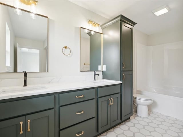 261 Colchester Dr, Iowa City, IA 52245 - full bathroom featuring double vanity, toilet, tub / shower combination, and tile patterned floors