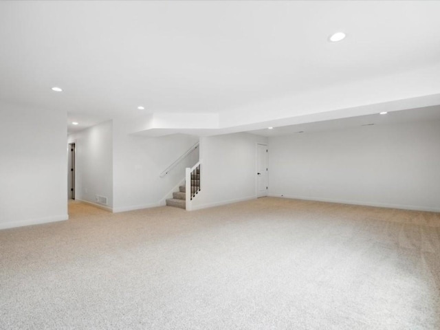 261 Colchester Dr, Iowa City, IA 52245 - finished basement with recessed lighting, stairway, light carpet, and baseboards