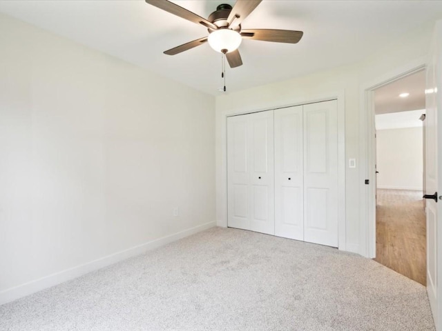 261 Colchester Dr, Iowa City, IA 52245 - unfurnished bedroom with carpet flooring, baseboards, a closet, and ceiling fan