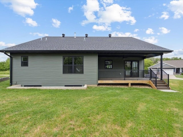 261 Colchester Dr, Iowa City, IA 52245 - rear view of property featuring a lawn, roof with shingles, and a wooden deck