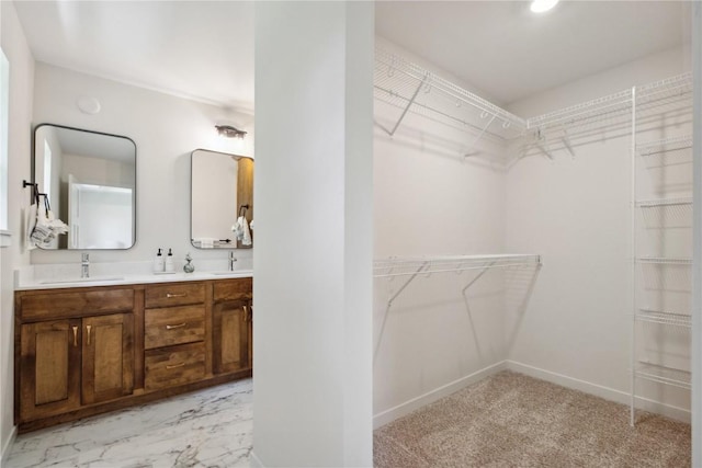 walk in closet featuring sink