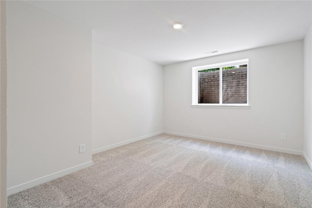 spare room featuring carpet floors