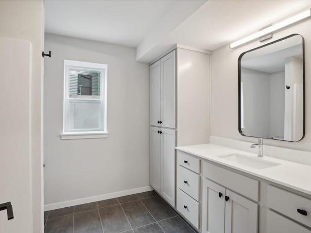 bathroom with tile patterned floors and vanity