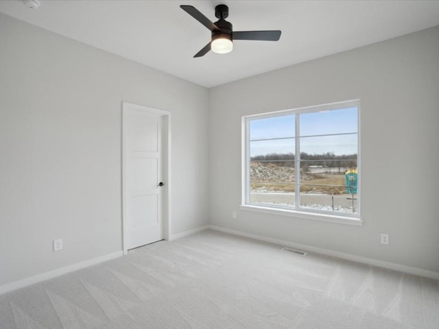 carpeted empty room with ceiling fan