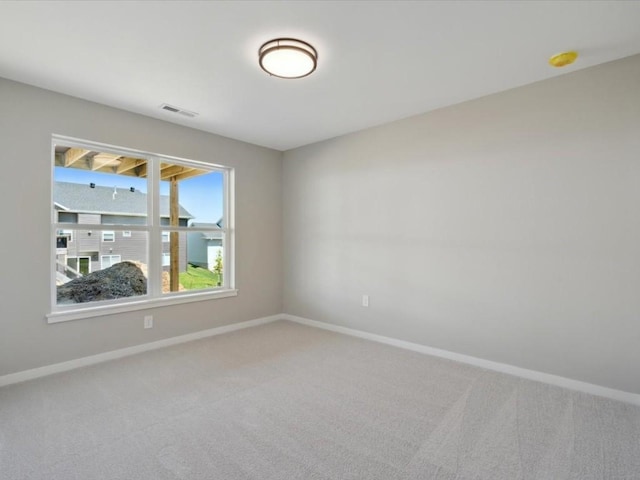 1423 Legend Dr, Tiffin, IA 52340 - carpeted spare room featuring baseboards and a smoke detector