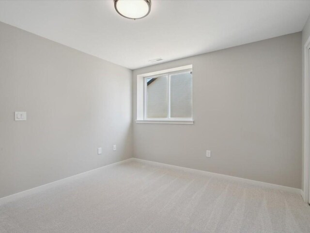 1423 Legend Dr, Tiffin, IA 52340 - unfurnished room featuring light colored carpet and baseboards