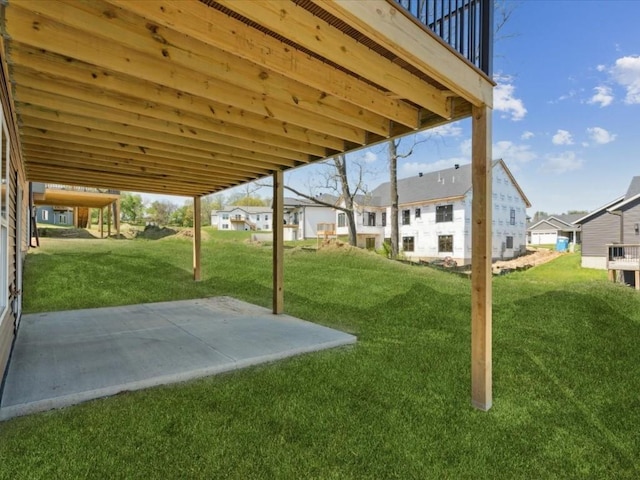 1423 Legend Dr, Tiffin, IA 52340 - view of green lawn featuring a patio area and a residential view