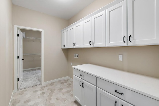 laundry area with cabinets and hookup for a washing machine