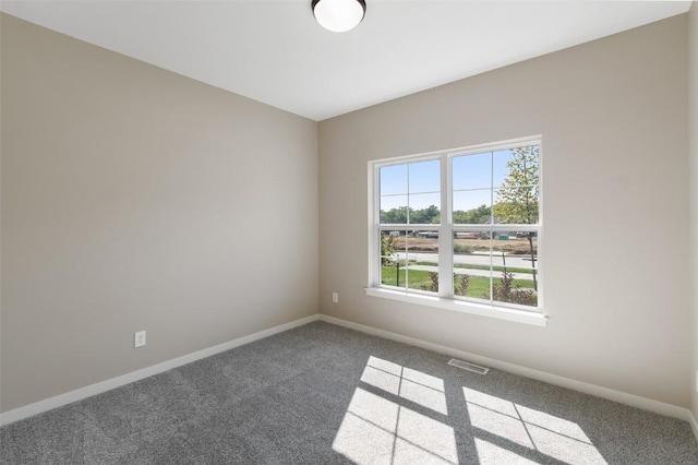 unfurnished room featuring carpet