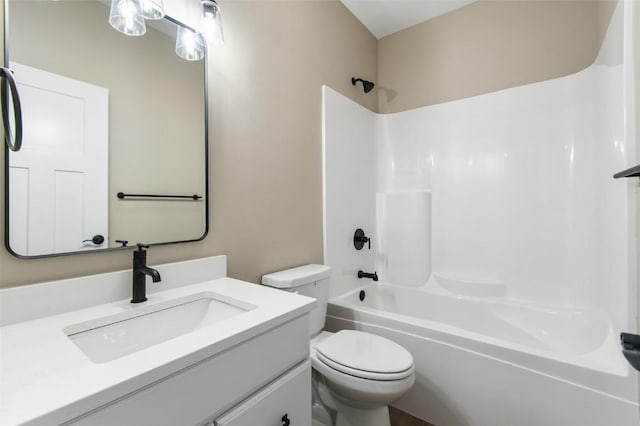 full bathroom featuring shower / washtub combination, vanity, and toilet