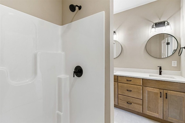 bathroom featuring vanity and walk in shower