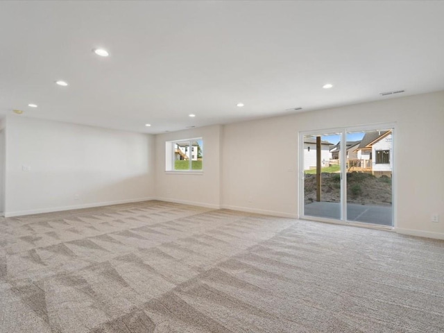 1501 Legend Dr, Tiffin, IA 52340 - unfurnished room featuring light colored carpet, recessed lighting, and baseboards