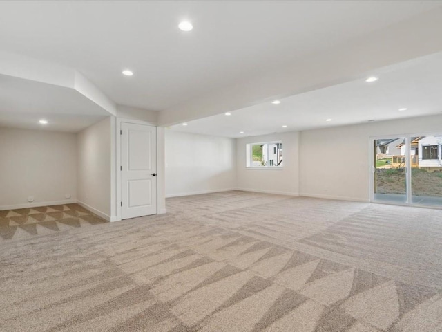 1501 Legend Dr, Tiffin, IA 52340 - below grade area with light carpet, recessed lighting, and baseboards