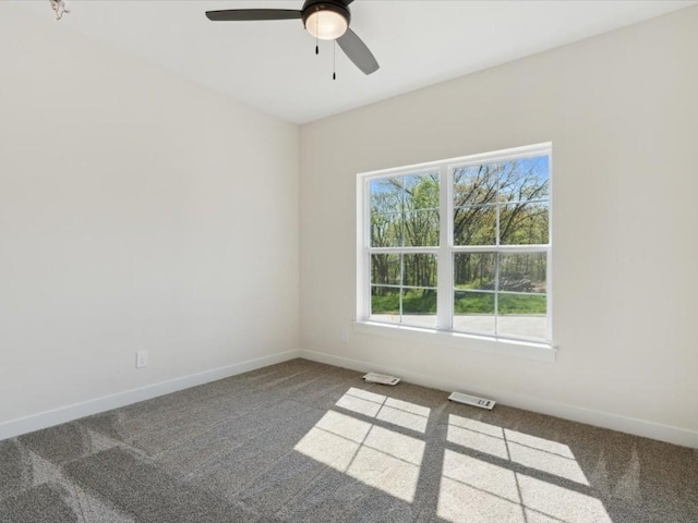 1501 Legend Dr, Tiffin, IA 52340 - carpeted spare room featuring ceiling fan and baseboards