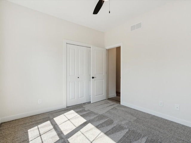 1501 Legend Dr, Tiffin, IA 52340 - unfurnished bedroom with carpet floors, a closet, baseboards, and ceiling fan