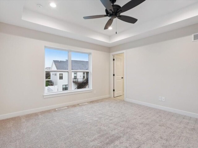 314 Sierra Trce, Coralville, IA 52241 - carpeted empty room featuring a tray ceiling, recessed lighting, and a ceiling fan