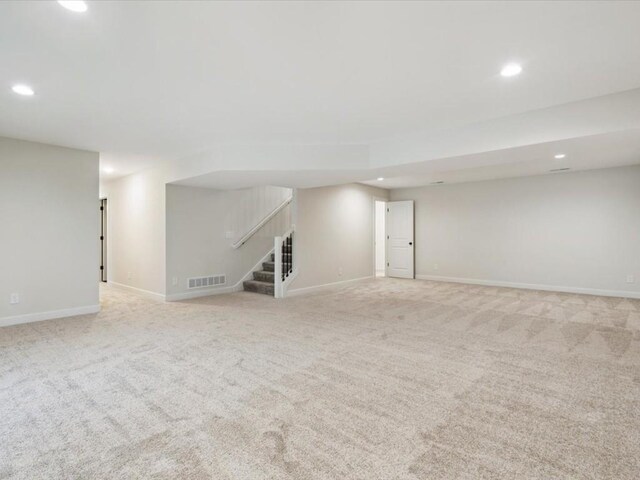 314 Sierra Trce, Coralville, IA 52241 - spare room with recessed lighting, stairway, and carpet flooring
