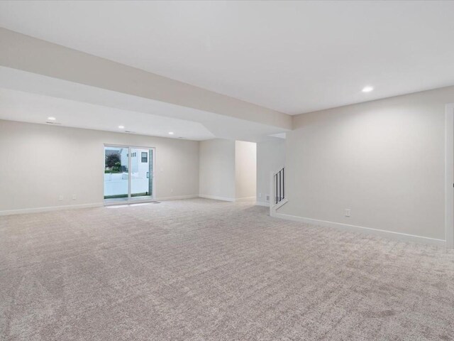 314 Sierra Trce, Coralville, IA 52241 - empty room featuring recessed lighting, stairs, and light colored carpet