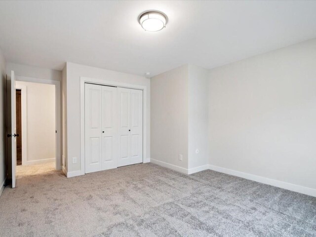 314 Sierra Trce, Coralville, IA 52241 - unfurnished bedroom featuring carpet and a closet