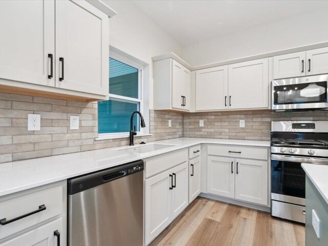 314 Sierra Trce, Coralville, IA 52241 - kitchen with stainless steel appliances, light countertops, and backsplash