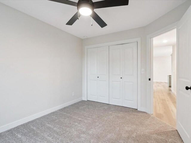 314 Sierra Trce, Coralville, IA 52241 - unfurnished bedroom with light colored carpet, a closet, and ceiling fan